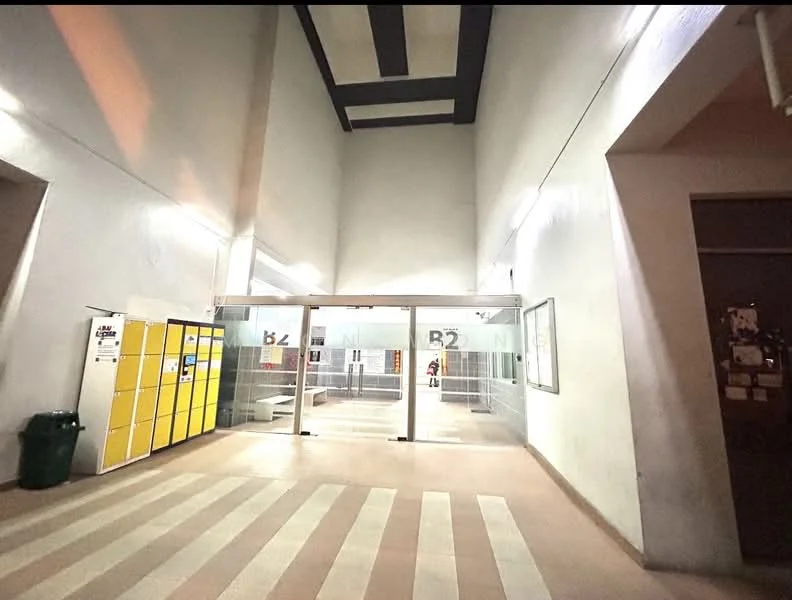 Room features: high ceiling, striped floor tiles in beige and cream, glass sliding doors, yellow lockers, white painted walls, exposed beams, overhead lighting; style: modern.