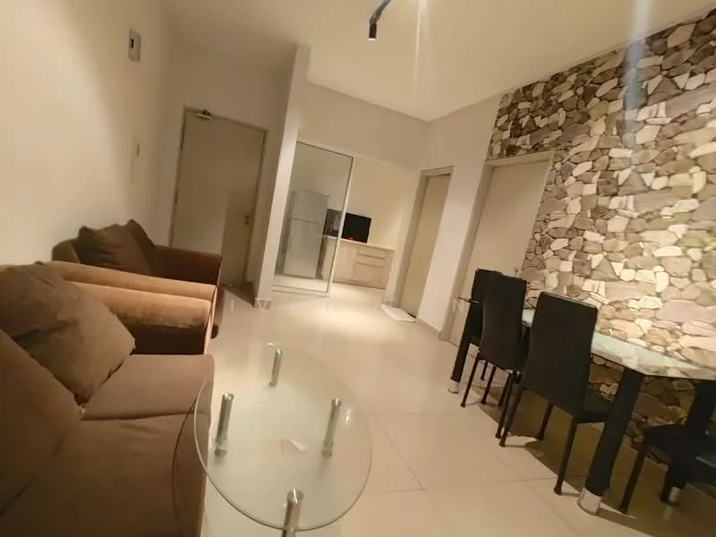 Living features: brown fabric sofa, glass coffee table, tile flooring, stone accent wall, recessed lighting, dining table with black chairs, open layout, neutral wall color; style: modern. Room features: doorway leading to other rooms, glass sliding door, neutral wall color.