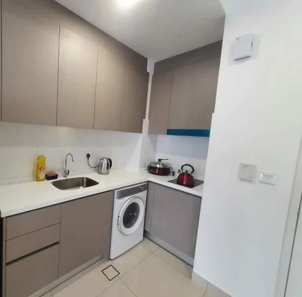 Kitchen features: single-bowl stainless-steel sink, chrome pull-down faucet, white quartz countertop, grey flat-panel cabinets, built-in washing machine, stainless-steel kettle, red kettle, stainless-steel stove, white tiled backsplash, recessed ceiling lights, ceramic tile flooring; style: modern.