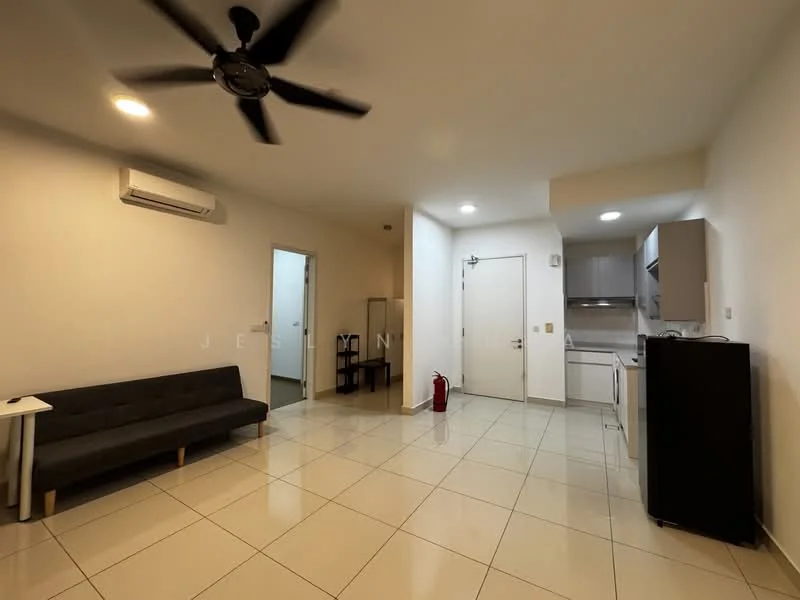 Living features: 3-seater fabric sofa in black, white painted walls, glossy tile flooring, ceiling fan with light, wall-mounted air conditioning unit, door leading to hallway, fire extinguisher, refrigerator, kitchen area with countertop, overhead cabinets; style: modern. Room features: white painted walls, glossy tile flooring, door leading to main entrance.