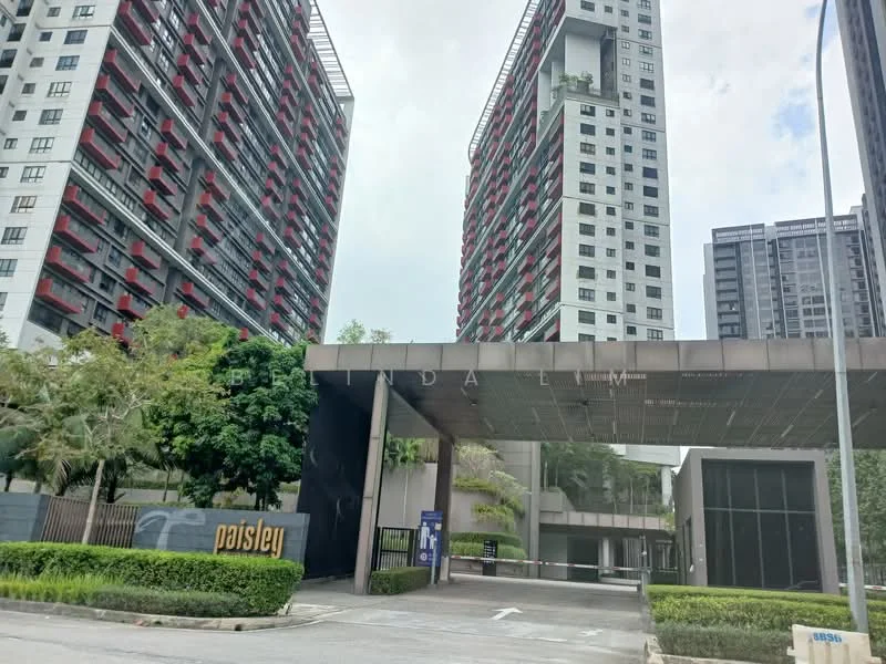 Exterior type: high-rise condominium; features: modern facade with glass and concrete, recessed balconies, landscaped entrance with greenery, security gate at entrance, multiple storeys visible, surrounded by mature trees, paved driveway, signage with 'paisley'; style: modern.