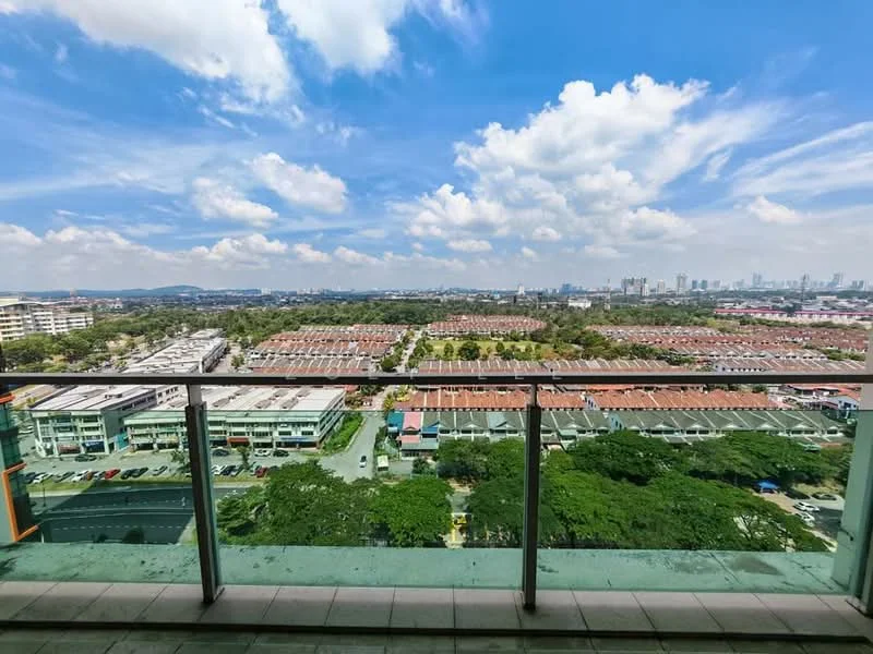 Exterior type: high-rise condominium; features: glass balcony railing, panoramic city view, surrounding greenery, view of residential area, clear blue sky, clouds, urban skyline in background; style: modern.