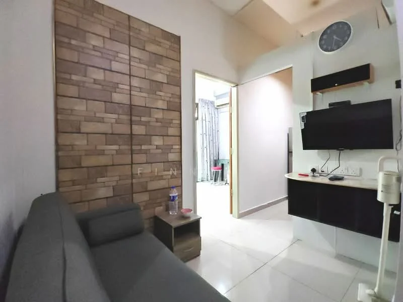 Living features: grey fabric sofa, wooden side table, wall-mounted TV, black TV console, decorative stone accent wall, white painted walls, recessed ceiling lights, clock on wall, ceramic tile flooring; style: modern. Room features: doorway leading to another room, light-colored walls, visible laundry area in background.