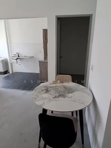 Dining features: round marble dining table, 2 wooden dining chairs, white painted walls, grey tile flooring, open layout to kitchen, doorway leading to hallway; style: modern. Kitchen features: kitchen cabinetry, sink, countertop, open layout to dining area; style: modern. Room features: white painted walls, grey tile flooring.