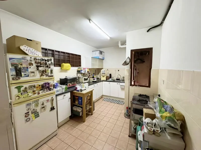 Kitchen features: white cabinetry, green countertop, stainless-steel fridge, built-in microwave, freestanding oven with gas hob, kitchen island with storage, tile flooring in beige, wall-mounted extractor fan, window with brown frame, various kitchen appliances, magnetic knife strip, decorative magnets on fridge.