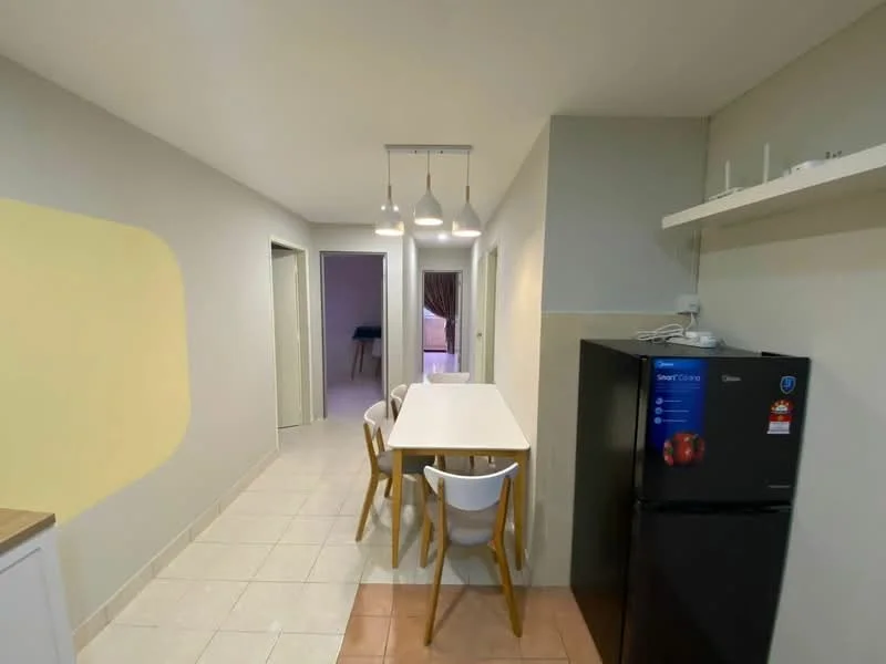 Kitchen features: white painted walls, tile flooring, 4-seater dining table, white dining chairs, black fridge, shelf above countertop, 3 pendant lights, open layout to hallway; style: modern.