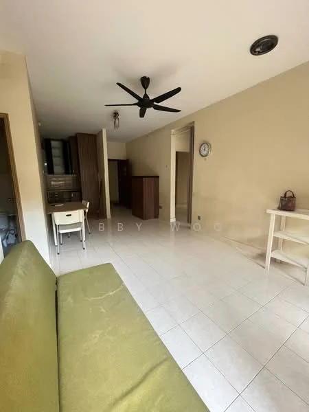 Living features: green fabric sofa, ceiling fan, wall clock, tile flooring, neutral painted walls, open layout, dining table with chairs, built-in cabinetry, doorway leading to kitchen, doorway leading to hallway.
