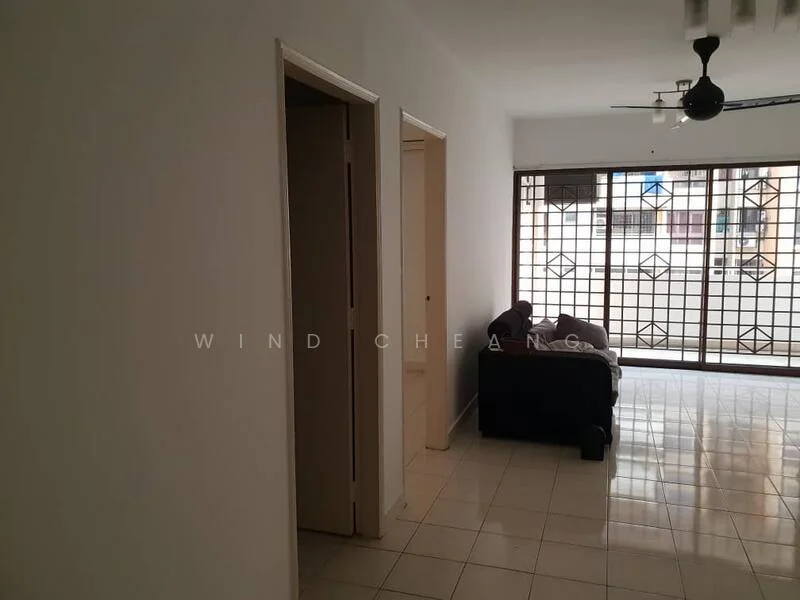 Living features: white painted walls, glossy tile flooring, 5-blade ceiling fan with light, large window with security grille, sofa in dark color, natural light from window, open layout, neutral color scheme; style: modern. Room features: doorway leading to another room, doorway leading to bathroom, white walls, tile flooring.