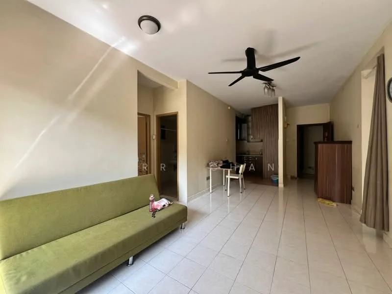 Living features: green fabric sofa, white tiled flooring, ceiling fan, wall-mounted light fixture, open layout to kitchen, neutral painted walls, window with natural light, dining table with chairs, wooden cabinet, kitchen area visible; style: modern.
