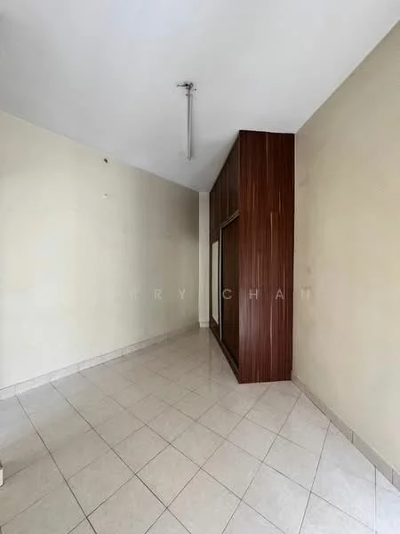 Room features: cream painted walls, tile flooring, built-in wardrobe with wood finish, single ceiling light fixture, corner space, empty room.