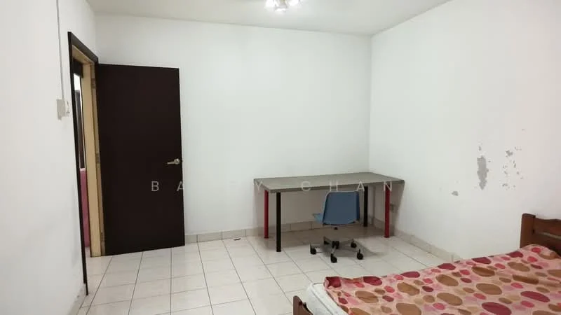 Room features: white painted walls, tile flooring, single bed, wooden bed frame, desk with metal legs, blue office chair, ceiling light fixture, door leading to another room, blank wall space, no visible decor; style: minimalist.