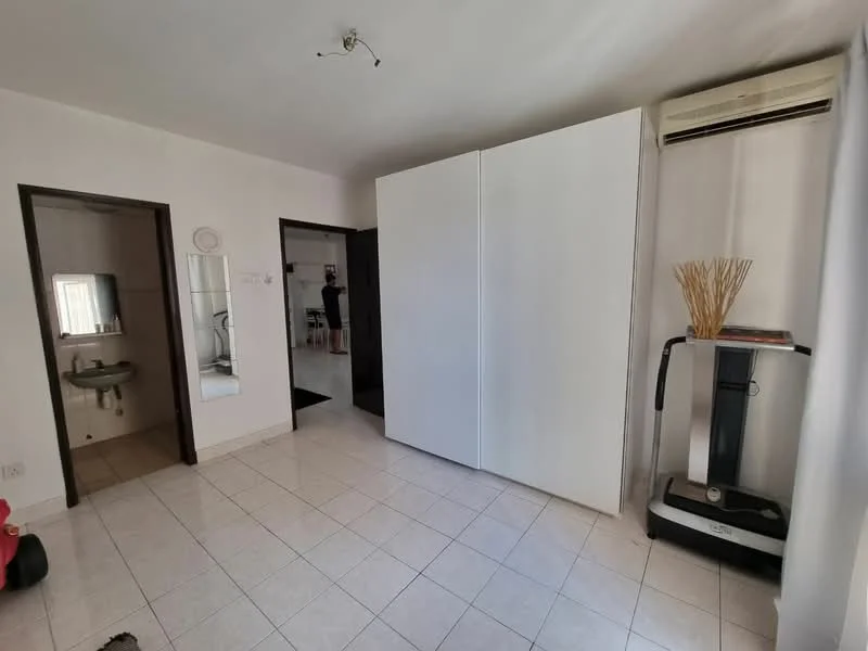 Room features: white painted walls, tile flooring, 1 wall-mounted split AC, built-in wardrobe, mirror on wall, doorway leading to another room, doorway leading to bathroom, exercise machine.