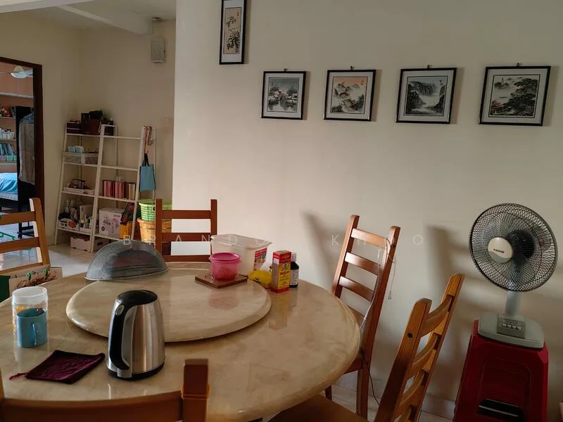 Dining features: round marble dining table, wooden dining chairs, kettle, plastic container, canister, fan, framed artwork on walls, white painted walls, tile flooring.