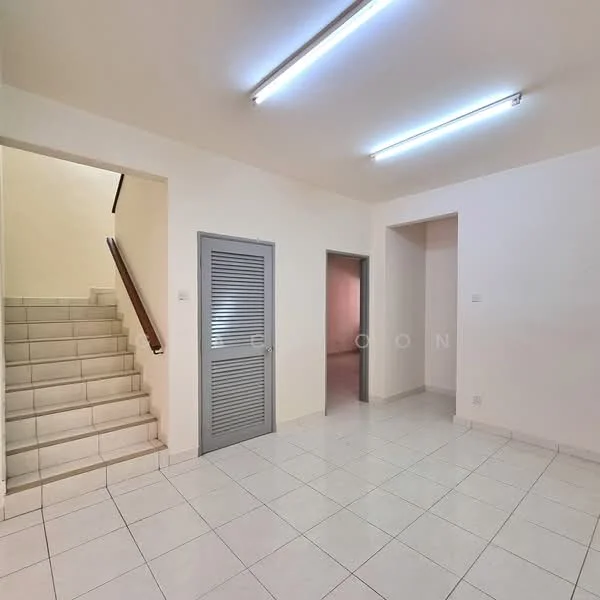 Room features: white painted walls, white tiled flooring, staircase with tiled steps, door with louvered panels, fluorescent ceiling lights, open layout, neutral color scheme, corner wall with no visible features; style: modern.