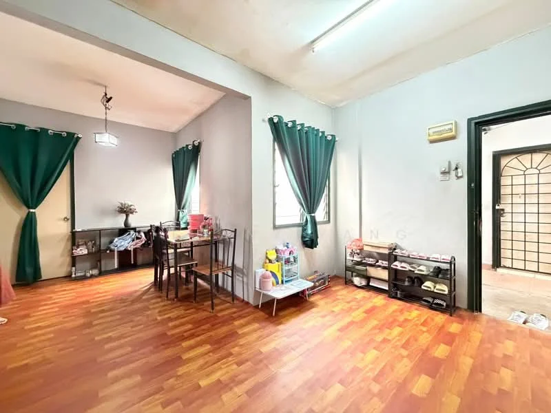 Living features: laminate wood flooring, grey painted walls, green curtains, dining table with four chairs, shelves with decorative items, shoe rack, two windows with natural light, ceiling light fixture.