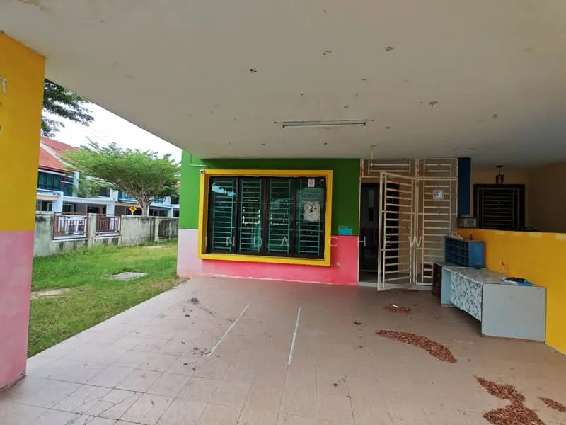 Exterior features: open porch area, green and yellow painted walls, sliding windows with metal grills, tiled flooring, grass area in front, exposed ceiling, wall-mounted light fixtures; style: modern.