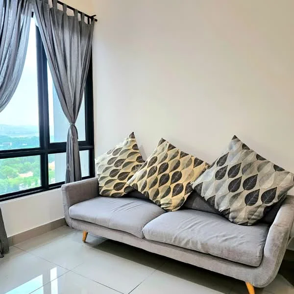 Living features: grey fabric sofa, two decorative cushions with leaf pattern, floor-to-ceiling windows, curtains in grey, glossy tile flooring, city view, light-colored walls, minimalist decor; style: modern; view: city.