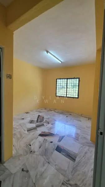 Room features: yellow painted walls, marble flooring, ceiling light fixture, window with metal grille, natural light from window.