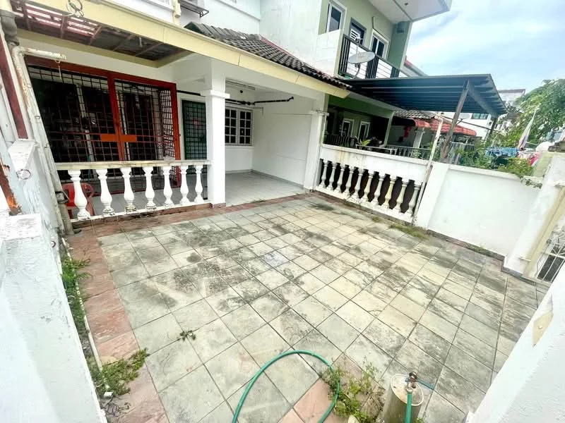 Exterior type: linked terrace house; features: paved outdoor area, white painted walls, balustrade railing, roofed patio, garden hose visible, surrounding greenery, sliding door access, outdoor tiles, partially shaded area; style: modern.