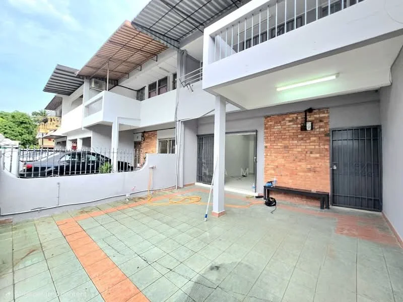 Exterior type: linked terrace house; features: brick facade, grey painted walls, covered porch area, paved flooring, metal gates, outdoor lighting, car parking space, fenced perimeter, overhead roof, open-air layout; style: modern.
