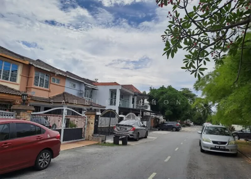 Exterior type: linked terrace house; features: two-storey linked terrace houses, brick facade, gated entrance, manicured front lawns, driveways with interlocking pavers, street lined with trees, clear blue sky, visible parked cars; style: modern.