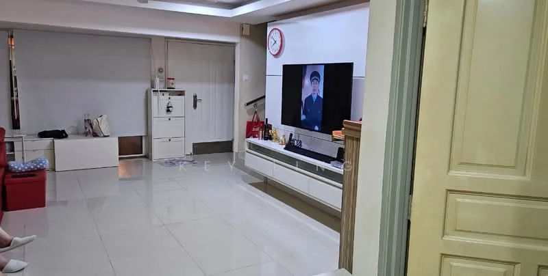 Living features: white painted walls, glossy tile flooring, wall-mounted TV, TV console with storage, clock on wall, sofa in red, blue patterned cushion, decorative items on console, large window with natural light, open layout to adjacent room; style: modern. Room features: cream painted walls, wooden door, light fixture on ceiling.