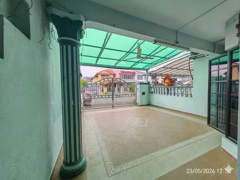 Exterior type: linked terrace house; features: covered patio with green canopy, decorative column with fluted design, tiled flooring with decorative border, metal gate, surrounding wall with railing, outdoor ceiling fan, open space for outdoor seating, urban neighborhood view; style: modern.