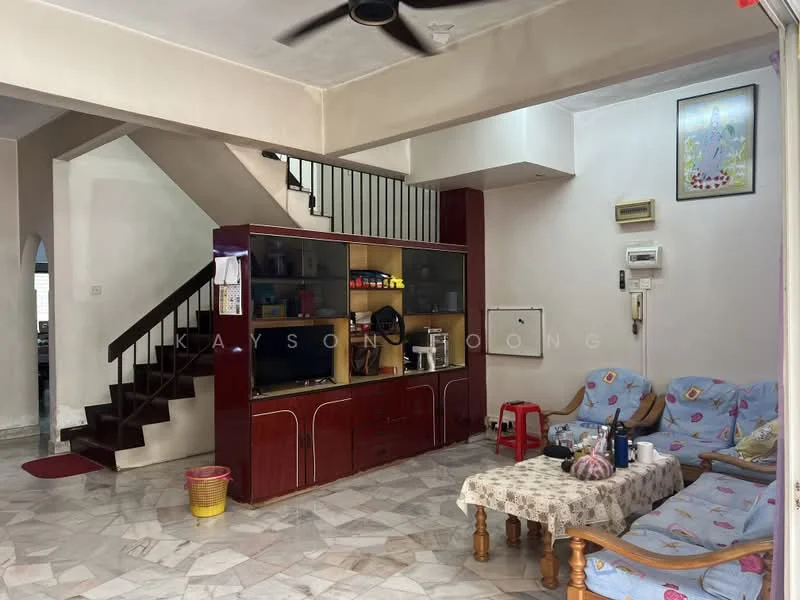 Living features: marble flooring, white walls, ceiling fan, sofa with floral pattern, wooden coffee table, TV console, wall-mounted TV, decorative artwork, staircase leading to upper floor, air conditioning unit, open layout, natural light from windows; style: modern.