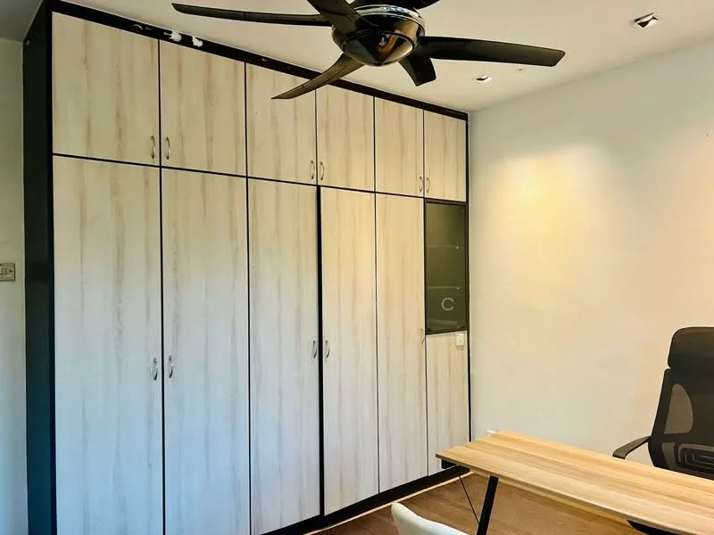 Study features: built-in wardrobe with light wood finish, black trim on wardrobe, 1 wall-mounted split AC, 5-blade ceiling fan, wooden desk, ergonomic office chair, white walls, recessed lighting; style: modern.