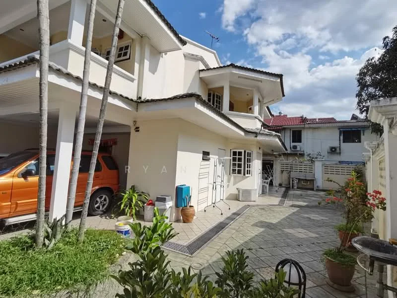 Exterior type: semi-detached house; features: two-storey building, cream painted facade, pitched tile roof, manicured lawn, paved driveway, outdoor seating area, garden with potted plants, car parked in driveway, visible air conditioning units, surrounded by greenery; style: modern.