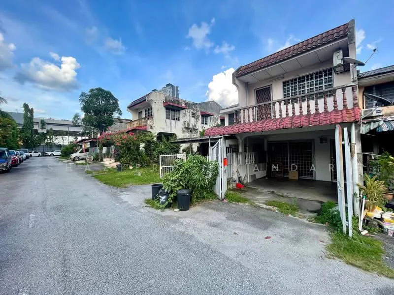 Exterior type: linked terrace house; features: two-storey linked terrace house, red tiled roof, white painted facade, front porch with car access, manicured lawn, surrounding greenery, paved driveway, adjacent houses visible, street view with parked cars, urban context; style: traditional.