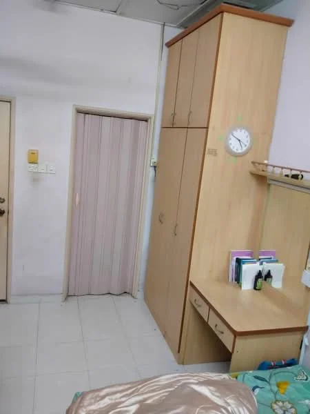 Room features: light pink painted walls, white tiled flooring, built-in wardrobe with wooden finish, wall-mounted clock, study desk with drawers, curtains, door to hallway, sliding door.