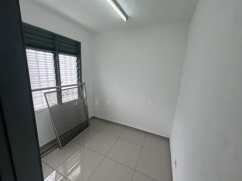 Room features: white painted walls, grey tiled flooring, sliding windows with horizontal slats, fluorescent ceiling light, empty space, no visible furniture.