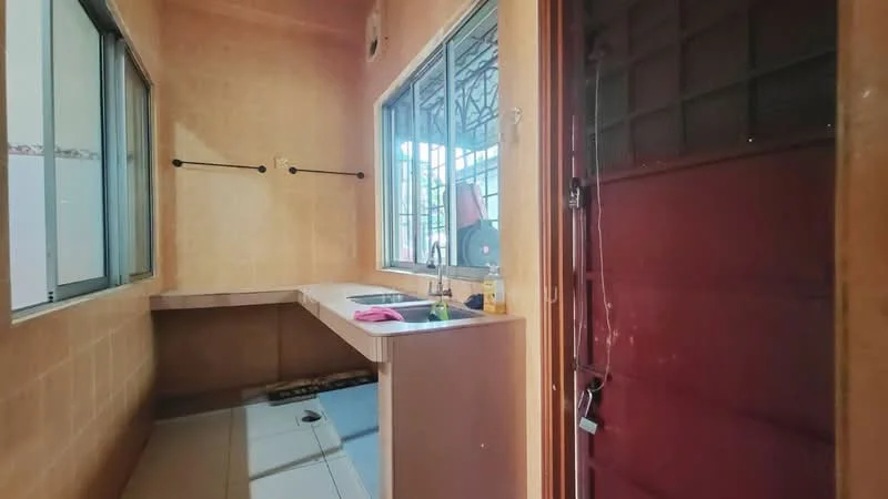 Laundry features: tile flooring, beige painted walls, single-bowl stainless-steel sink, countertop with storage space, window with metal grille, door with metal grille, clothes drying rack, plumbing fixtures.