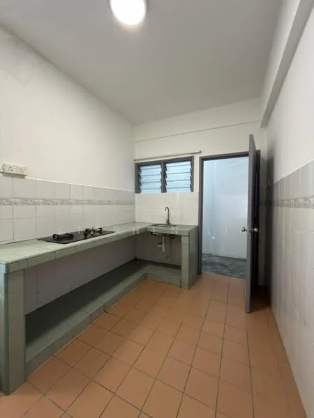 Kitchen features: white tiled walls, grey countertop, gas stove with two burners, single-bowl stainless-steel sink, brown tiled flooring, window with horizontal slats, door leading to another room.