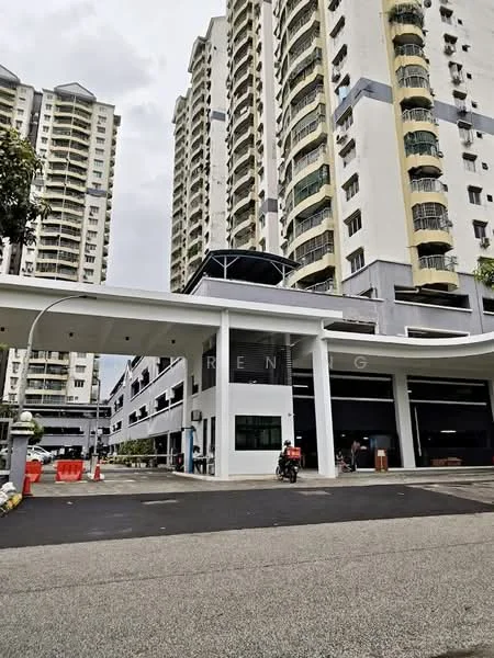 Exterior type: high-rise condominium; features: white painted facade, glass curtain wall, covered parking area, multiple storeys, entrance with awning, manicured landscaping, driveway with interlocking pavers, security gate, visible parking spaces, surrounded by mature greenery; style: modern.