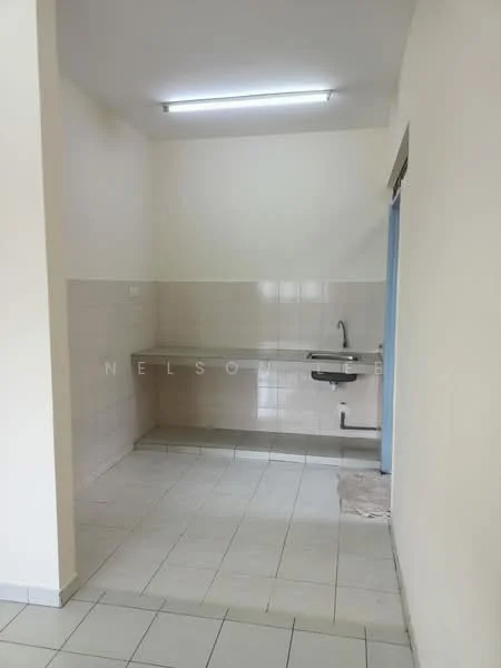 Kitchen features: white tiled walls, light grey tiled flooring, single-bowl stainless-steel sink, chrome faucet, countertop with no visible cabinetry, fluorescent ceiling lights, empty wall space, no visible appliances.