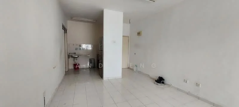 Room features: white painted walls, white tiled flooring, single ceiling light fixture, kitchenette area with sink, open space layout, no visible furniture, electrical outlets, window with no treatments; style: minimalist.