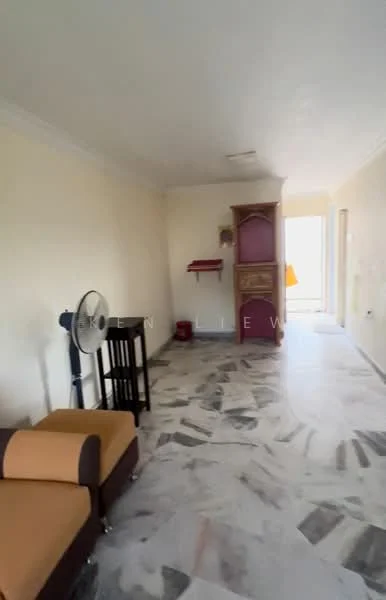 Room features: marble flooring, cream painted walls, ceiling with crown moulding, single ceiling fan, wooden side table, brown fabric sofa, wooden cabinet, doorway leading to outdoor area; style: modern.
