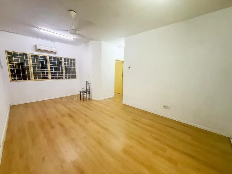 Living features: laminate flooring, white painted walls, ceiling fan, wall-mounted air conditioning unit, large windows with grilles, single chair, doorway leading to another room.