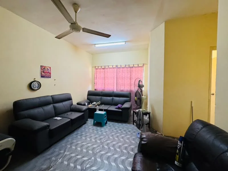 Living features: 3-seater fabric sofa in black, 2-seater fabric sofa in black, ceiling fan, window with sheer curtains, light-colored painted walls, laminate flooring, wall-mounted clock, floor fan, coffee table, decorative wall art.