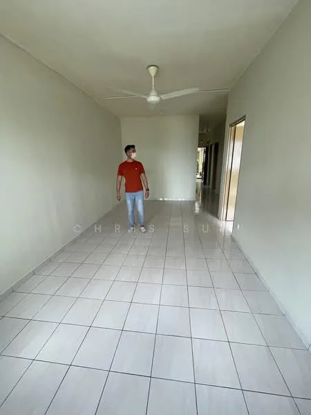 Room features: white painted walls, glossy ceramic tile flooring, ceiling fan, natural light from windows, neutral color scheme, spacious layout, doorway leading to other rooms, no visible furniture or decor; style: minimalist.