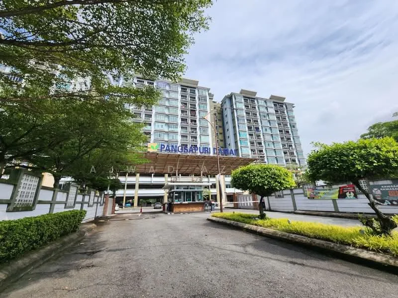 Exterior type: mid-rise condominium; features: glass curtain wall, white painted facade, projecting balconies, manicured lawn, mature trees, paved driveway, entrance gate, signage at entrance, surrounded by greenery; style: modern.