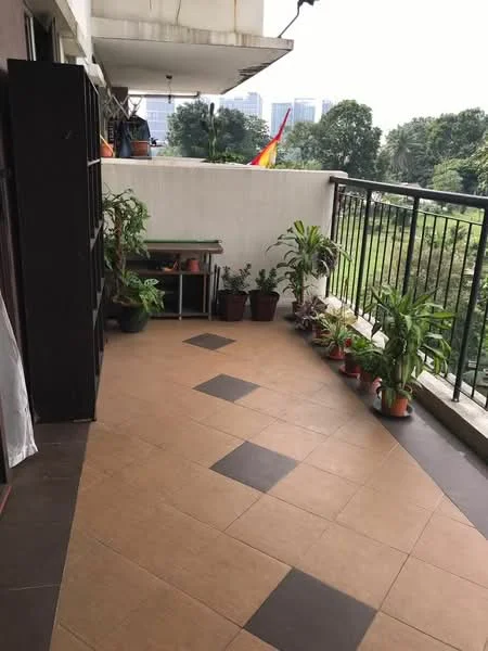 Balcony features: tiled flooring with brown and cream tiles, black metal railing, potted plants, wooden table, outdoor space, greenery view; view: garden.
