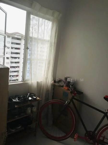 Room features: white painted walls, light-colored flooring, window with sheer curtains, bicycle, wooden shelving unit, cardboard boxes, natural light from window; style: minimalist; view: city.