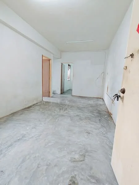 Room features: unfinished concrete flooring, white painted walls, no visible ceiling features, single door, door frame visible, open doorway leading to another room, no visible windows, minimal decor; style: minimalist.