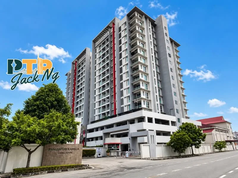 Exterior type: mid-rise condominium; features: grey painted facade, red accent panels, balconies on upper floors, flat roof, approximately 10-storey high-rise, manicured landscaping, trees in front, open-air parking area, main entrance with awning; style: modern.