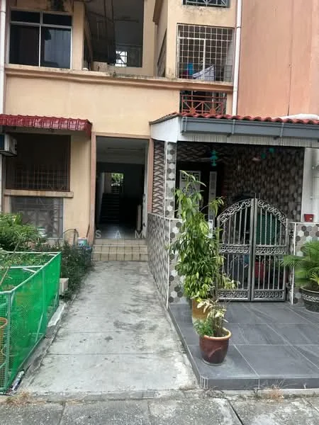 Exterior type: linked terrace house; features: pink painted facade, decorative metal gate, tiled porch area, potted plants, concrete pathway, exposed brick wall, gravel landscaping, green fencing, staircase visible through entrance, window grills; style: modern.
