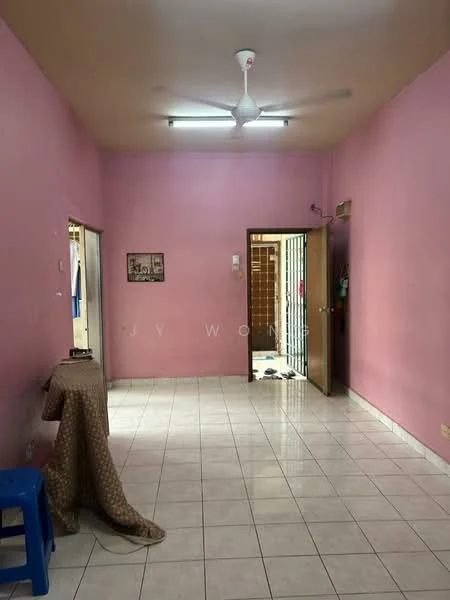 Room features: pink painted walls, white ceiling, ceiling fan, white tiled flooring, two doors, one window, table covered with fabric, blue plastic stool, light fixture on ceiling.