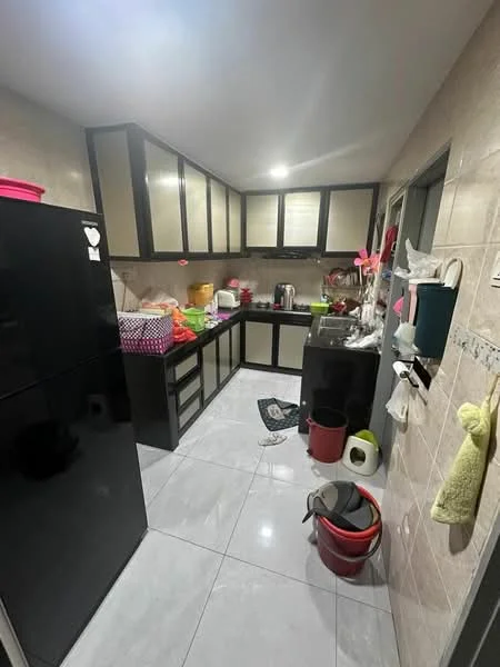 Kitchen features: black refrigerator, black cabinetry, white countertop, ceramic tile flooring, stainless-steel sink, chrome faucet, kettle, multiple storage containers, cleaning supplies, wall-mounted hooks, colorful plastic storage bins; style: modern.